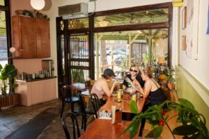 Vibrant interior of Holbox Los Angeles with counter seating